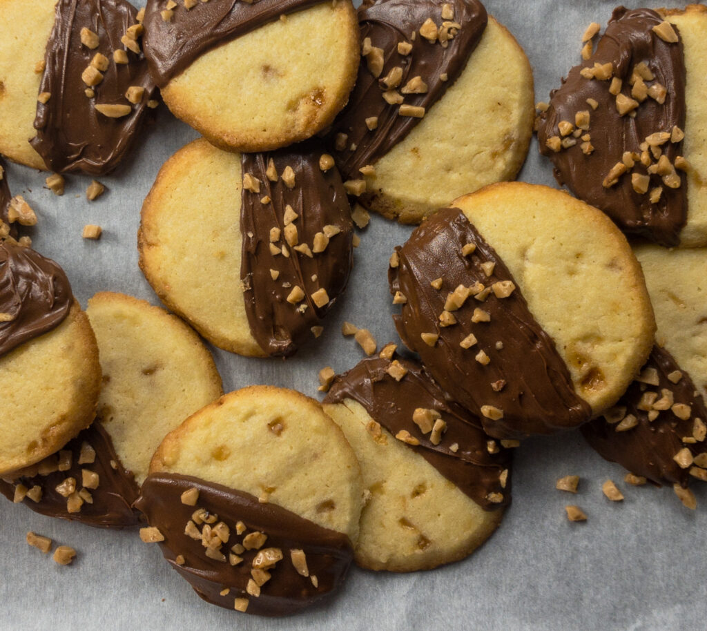 chocolate dipped toffee butter cookies from taming demons for beginners by Annette Marie