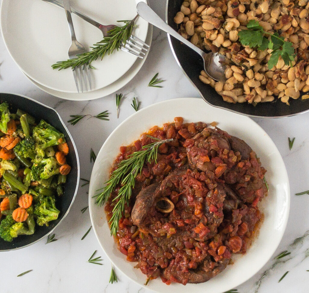 braised lamb with white beans and sautéed vegetables