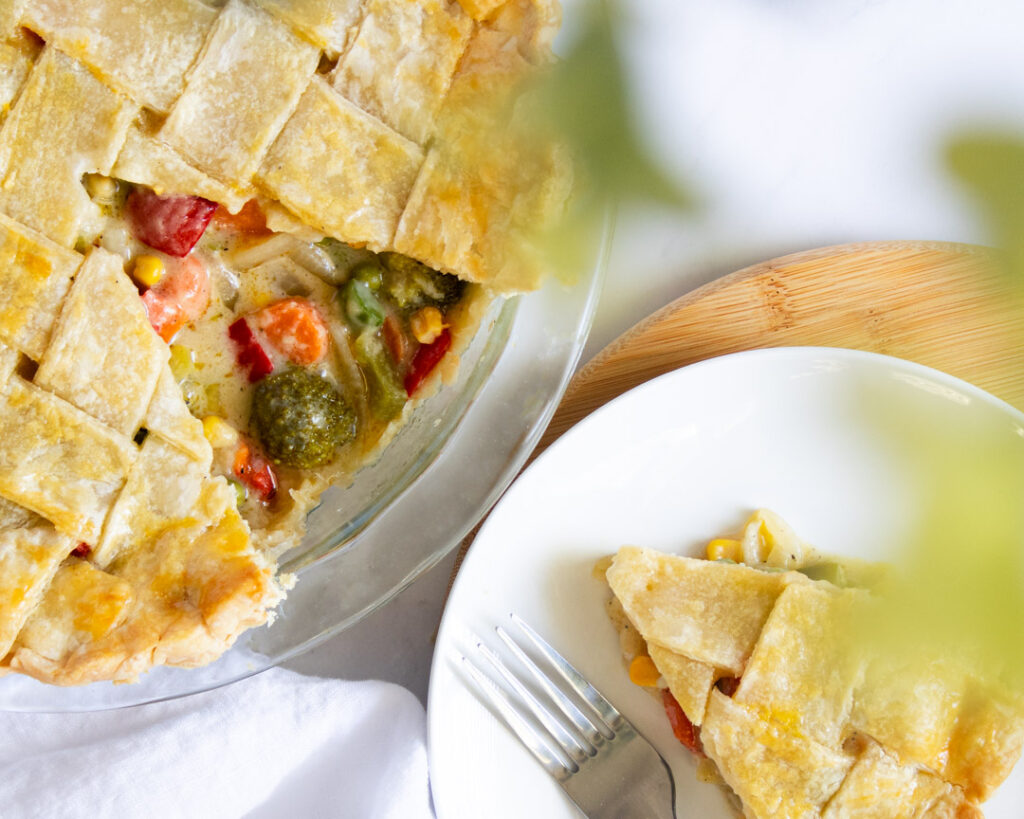 chess-topped vegetarian potpie with a slice on the side